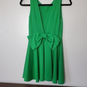 Green dress with a large bow